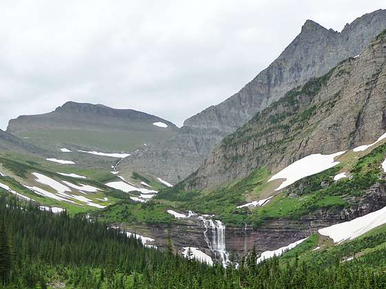 Closeup of Morning Eagle Falls with Piegan Mountain and the Bishops Cap in the background 